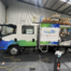 Quick Fix Solar & Electrical truck parked inside a workshop with full rear box wrapv